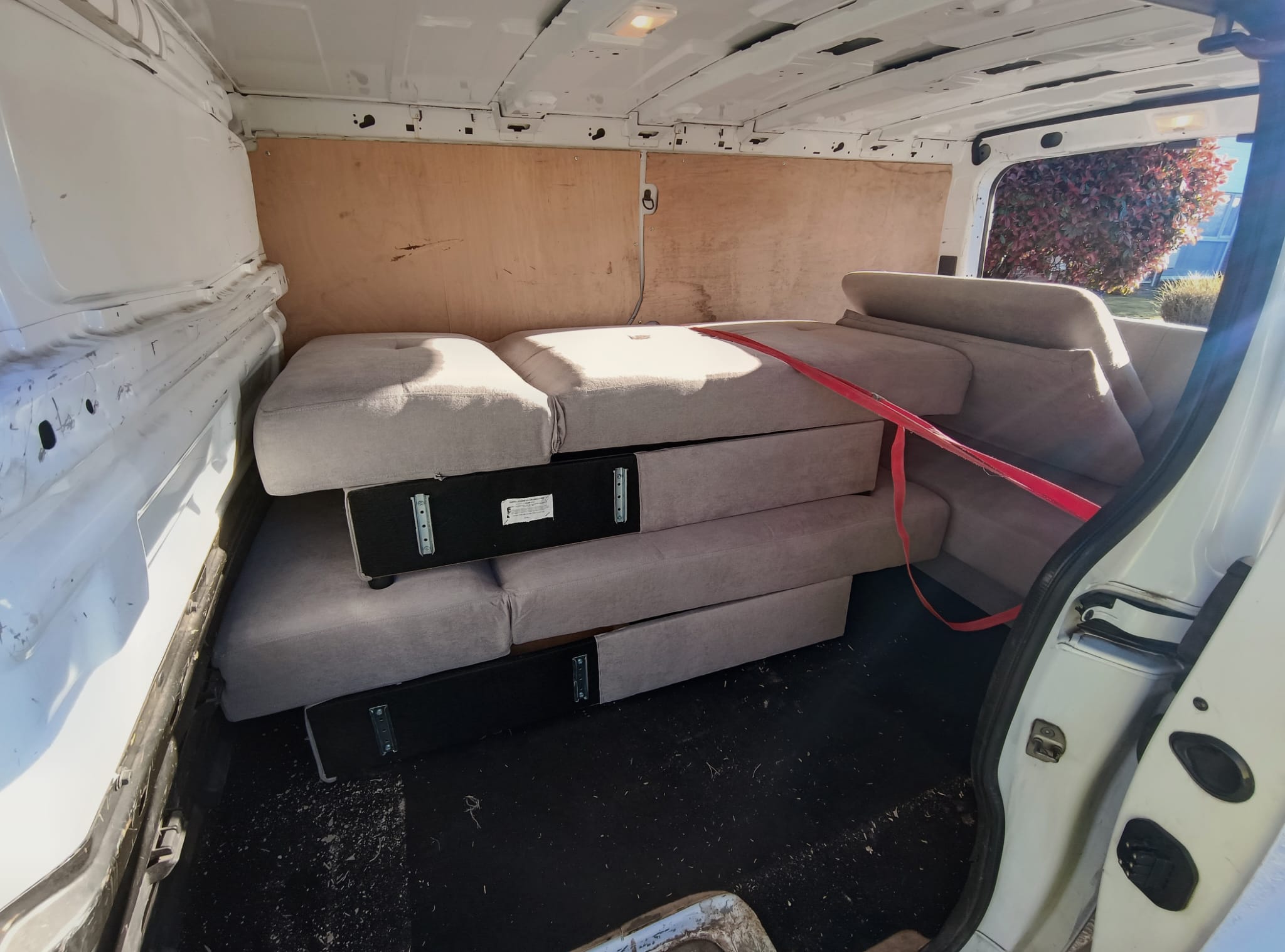 Sofa being loaded into van