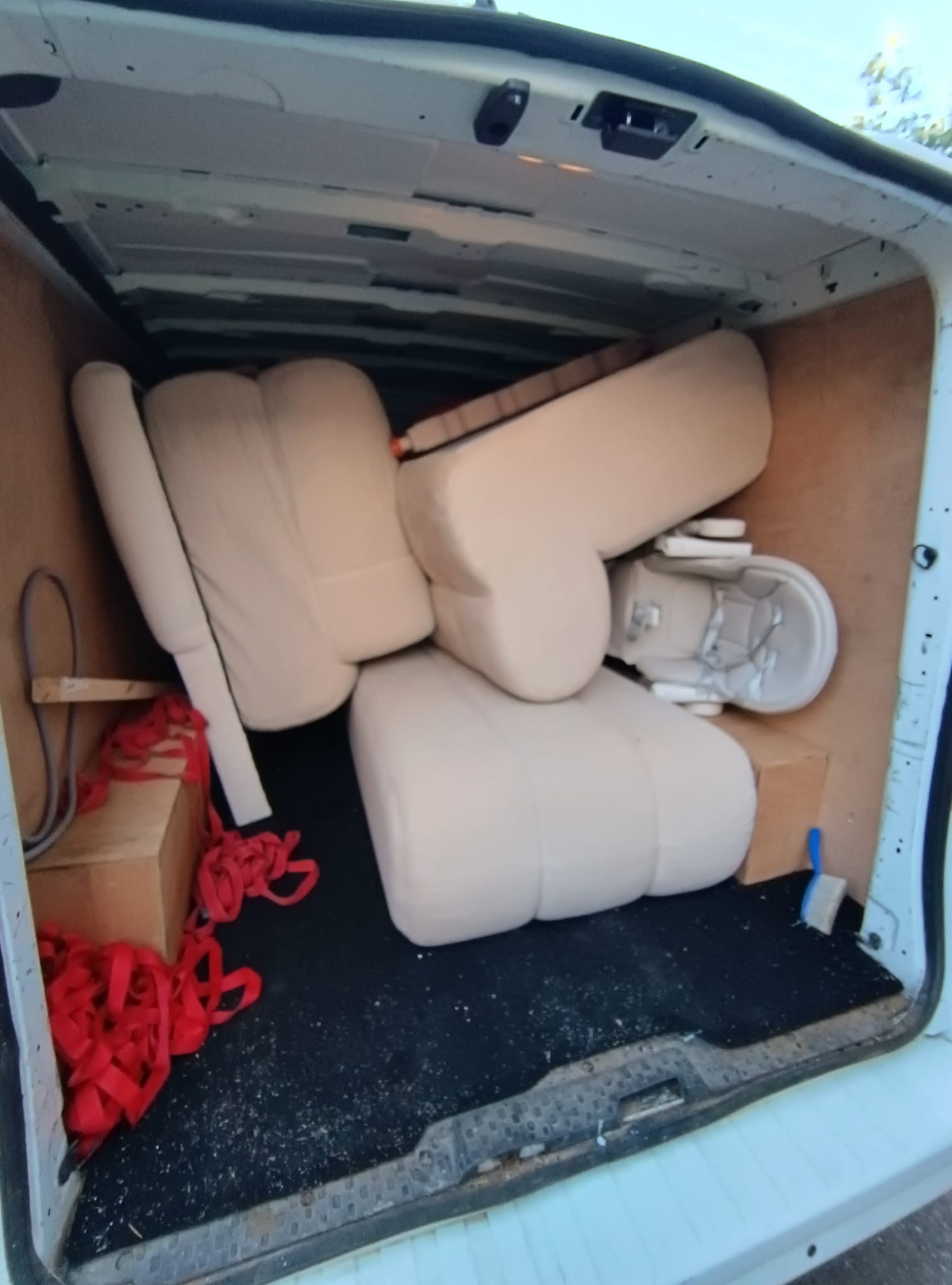 House removal team loading sofa in Doncaster